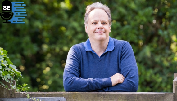 Photo of Charles leaning on a gate